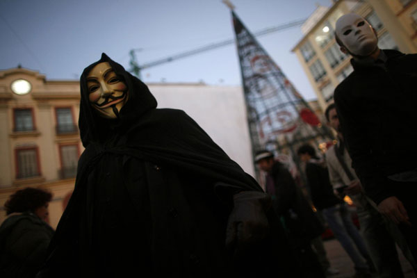 'Anonymous' protesters rally for Assange