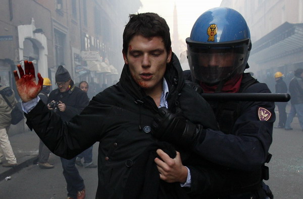 Riots in Rome as Berlusconi survives vote