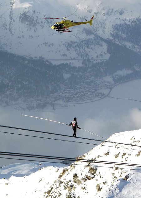 Daring Swiss acrobat challenges mountain walk