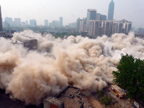 Old buildings demolished by directional blasting
