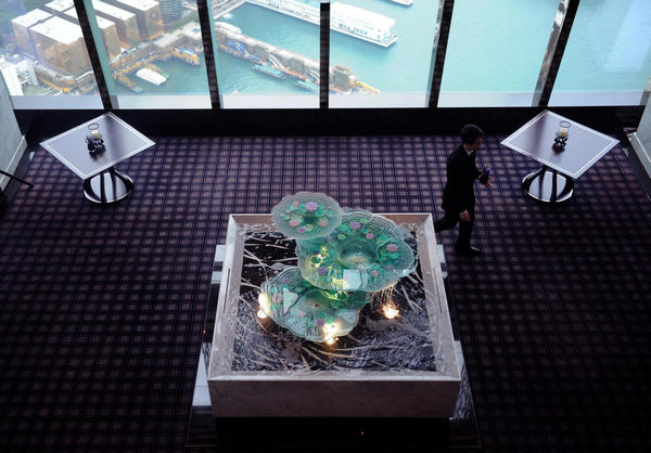 A staff member prepares for the opening ceremony of a Ritz-Carlton Hotel in Hong Kong, south China, May 3, 2011. World's highest hotel opens in Hong Kong