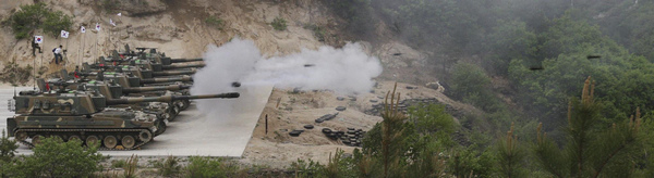 The ROK's Army's K-9 self-propelled artilleries fire during a live fire drill against possible attacks from DPRK at Seungjin fire range in Pocheon, about 46 km (28 miles) northeast of Seoul and about 15 km (9 miles) south of the demilitarized zone separating the two Koreas, May 19, 2011. South Korean Army conducts live fire drill