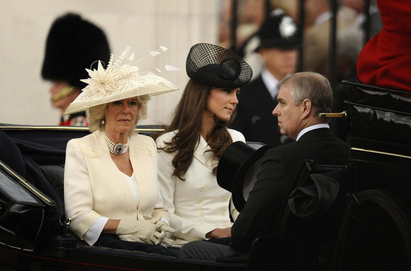 Britain's Camilla, Duchess of Cornwall, Catherine, Duchess of Cambridge (C) and Prince Andrew sit in a horse drawn carriage as they make their way from Buckingham Palace to attend the Trooping the Colour ceremony in central London June 11, 2011. Britain marks Queen's birthday