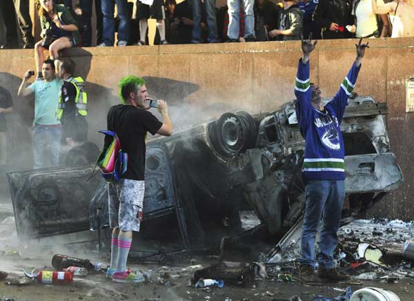 Cars set on fire in Vancouver following loss
