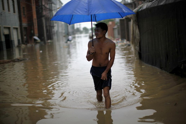 Worst floods in 56 yrs inundate E China village