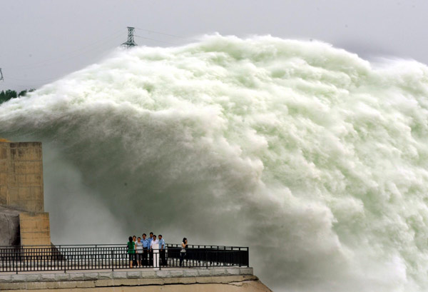 Flood discharge a dramatic scene at reservoir