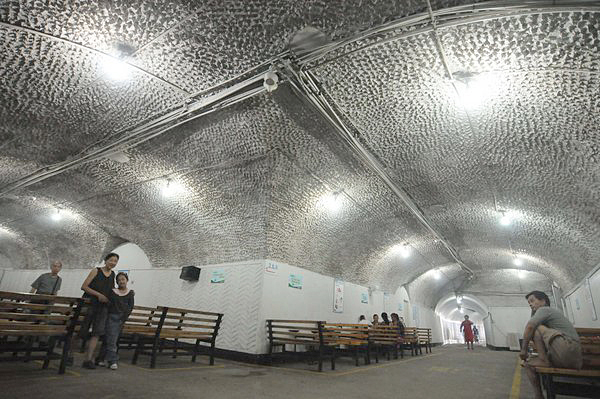 People cool off in air raid shelters
