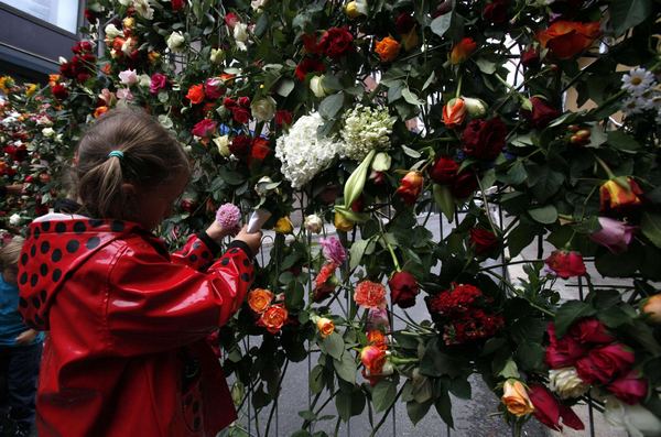 Sea of flowers marks vigil for twin attack victims