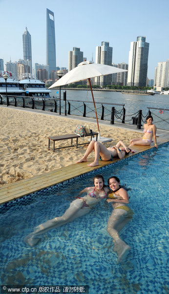 Sand, swimming, and the city skyline on the Bund