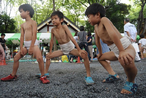 Undersize sumo wrestlers at Japan festival