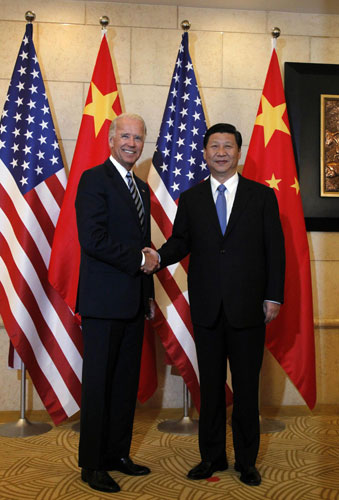 Xi, Biden talk business issues in Beijing