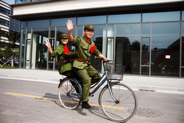 Couples marry in Red Army uniforms