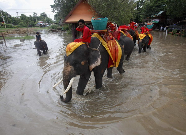 Storm-triggered floods soak Thailand