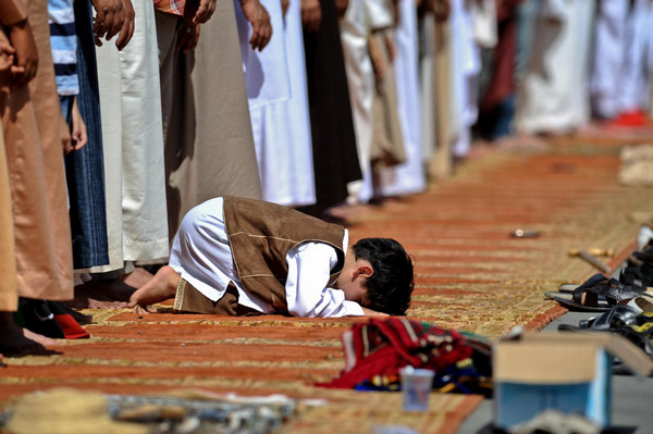 Libyan Muslims pray at Martyr's Square