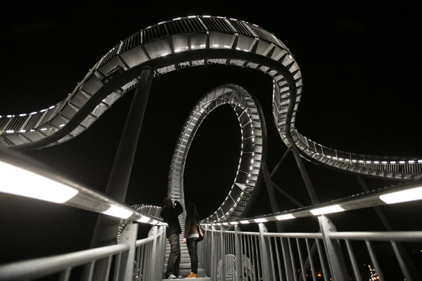 Walk on magical curved steel sculpture