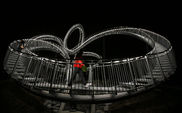Walk on magical curved steel sculpture