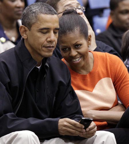Obamas attend a basketball game