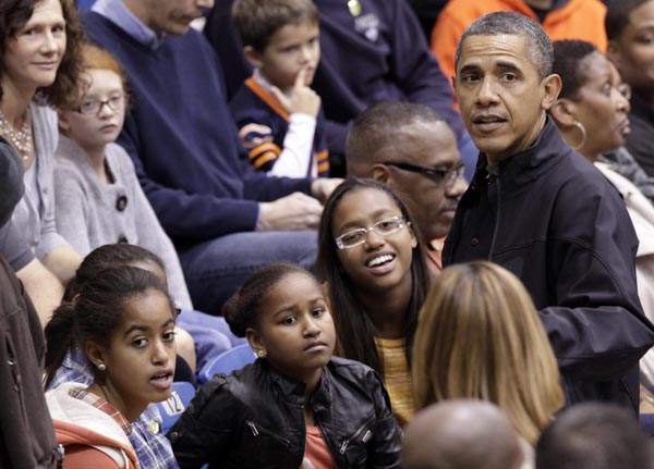 Obamas attend a basketball game