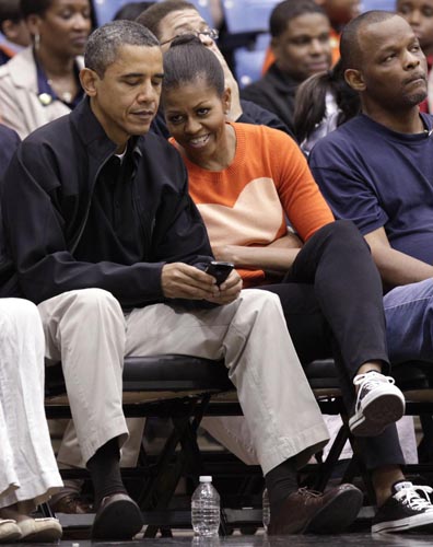 Obamas attend a basketball game
