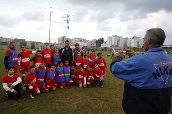 Palestinian and Israeli boys play soccer in tournament