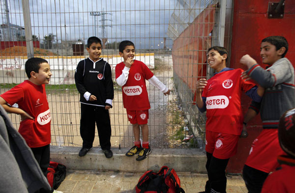 Palestinian and Israeli boys play soccer in tournament