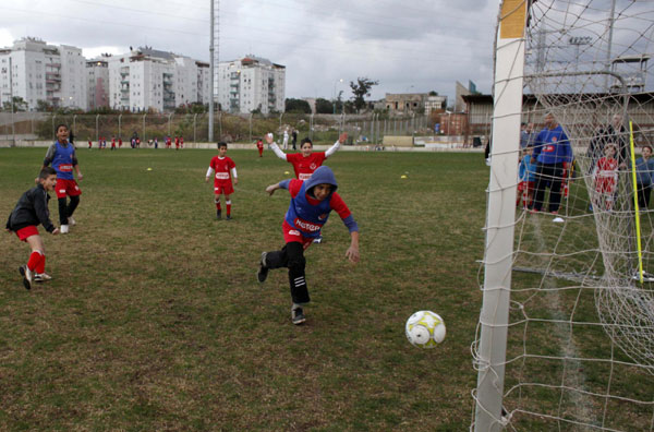 Palestinian and Israeli boys play soccer in tournament