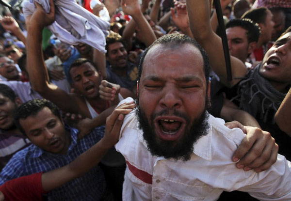 Supporters of Morsy protest against army in Cairo
