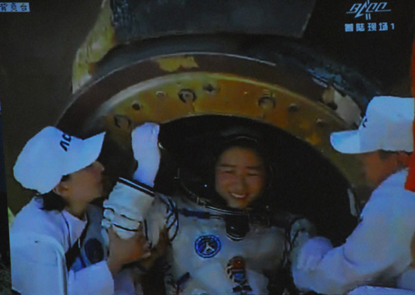 Astronauts come out of the return capsule
