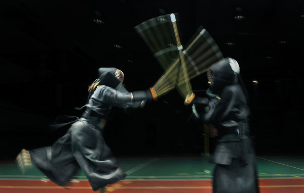 Office workers fight kendo to stay strong