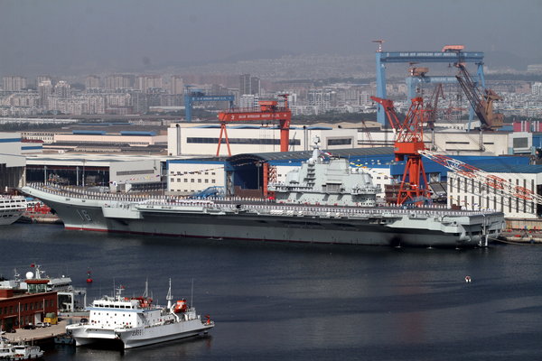 Hu attends aircraft carrier handover ceremony