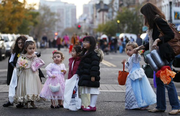 Halloween parade on after storm delay