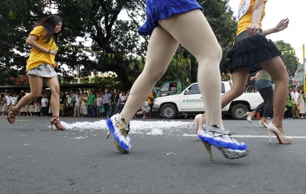 (Stiletto Race) participants run along the 500 m stretch of Shoe ...