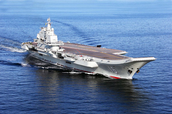 China conducts flight landing on aircraft carrier