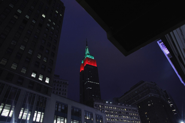 Empire State Building lit up in red and green