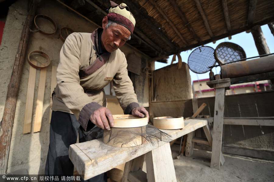 Making flour sifter now a craft of the past