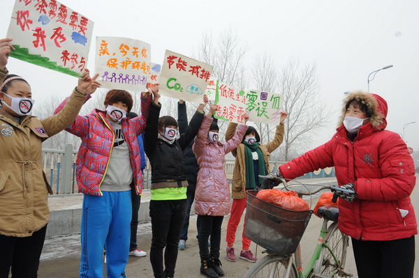 Masked students call for clean environment