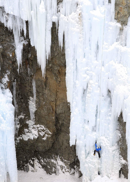 Climber on Swiss ice wall