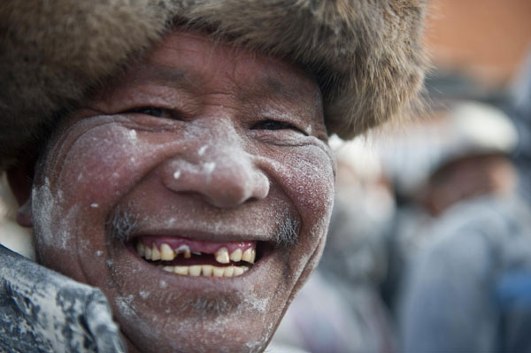 Tibetans welcome new year with flour fight