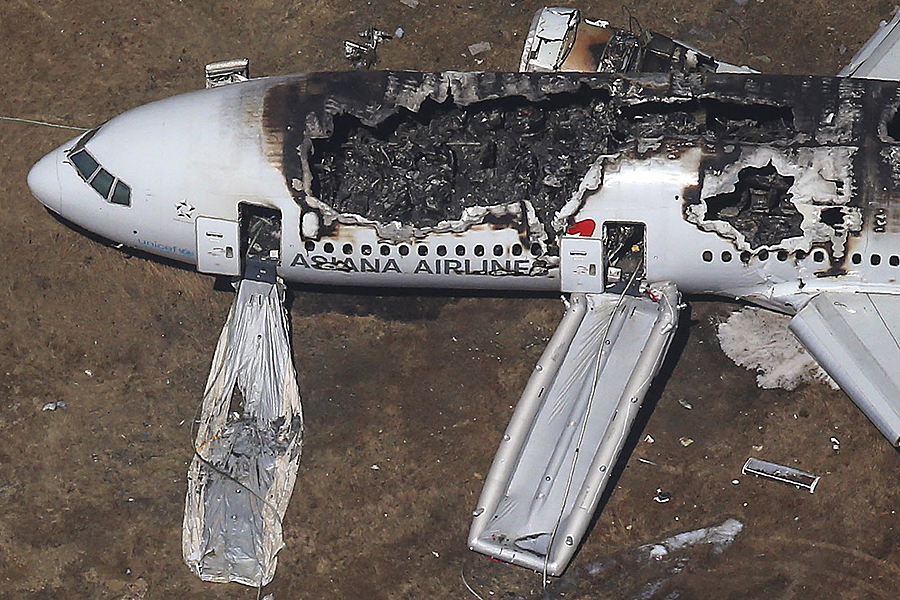 An aerial view of an Asiana Airlines Boeing 777 plane is seen after it crashed while landing at San Francisco International Airport in California on July 6, 2013. Two people were killed and 130 were hospitalized after the plane crash-landed at San Francisco International Airport on Saturday morning, San Francisco Fire Department Chief Joanna Hayes-White said. The figures cited by Hayes-White leave 69 people still unaccounted for in the accident. The Boeing 777, which had flown from Seoul, South Korea, was carrying 307 people. Asiana flight crashes at SFO