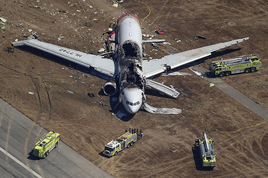 Firefighters surround an Asiana Airlines Boeing 777 plane after it crashed while landing at San Francisco International Airport in California on July 6, 2013. Two people were killed and 130 were hospitalized after the plane crash-landed at San Francisco International Airport on Saturday morning, San Francisco Fire Department Chief Joanna Hayes-White said. The figures cited by Hayes-White leave 69 people still unaccounted for in the accident. The Boeing 777, which had flown from Seoul, South Korea, was carrying 307 people. Asiana flight crashes at SFO