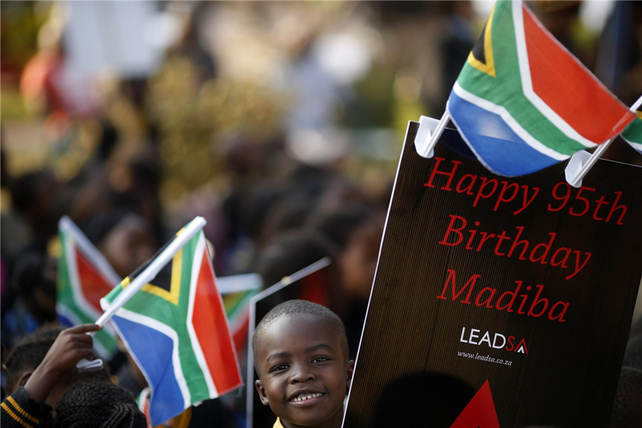 'Improving' Mandela marks 95th birthday