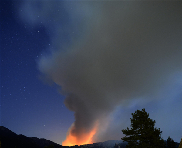 Firefighters hold line against California wildfire