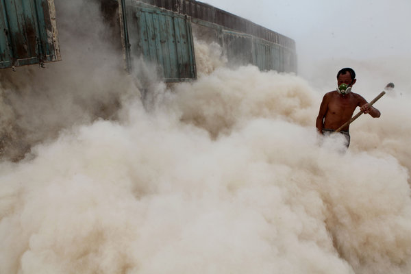 Hard, dusty labor in sweltering times