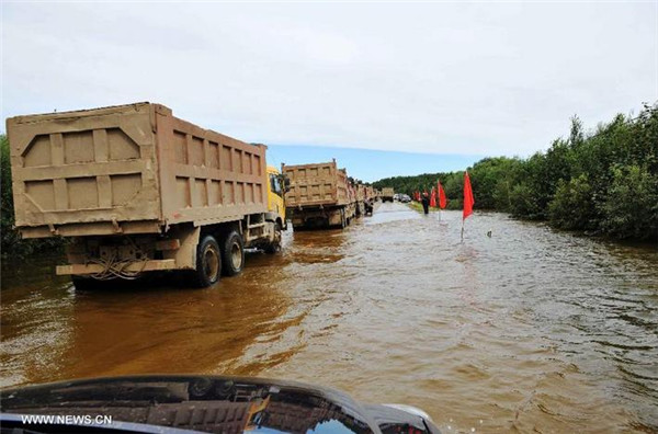 Floods cut off roads in NE China's county