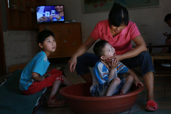 Orphans in C China experience family life