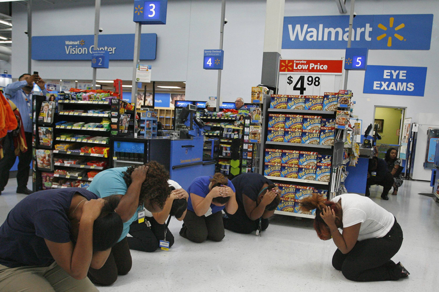 Walmart employees practice the drop, cover