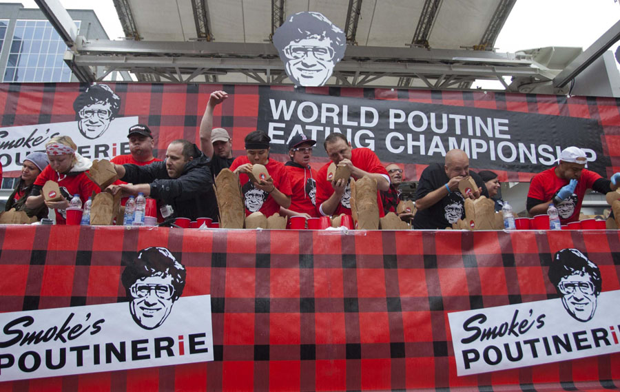 Eating champion gobbles 48 boxes of poutine