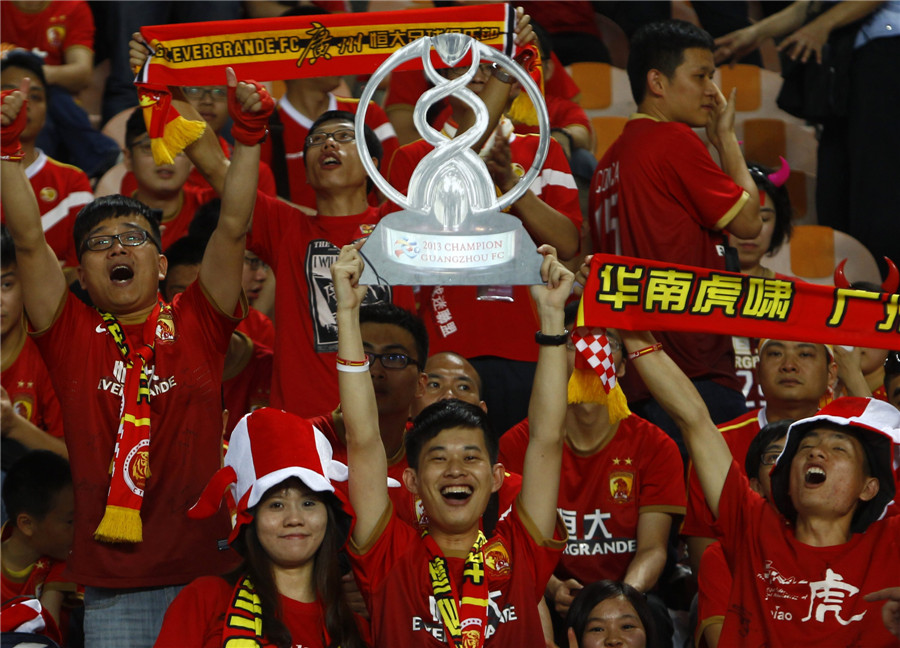 Football fans cheer for Guangzhou Evergrandeu