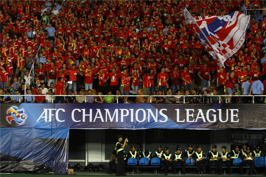 Football fans cheer for Guangzhou Evergrandeu