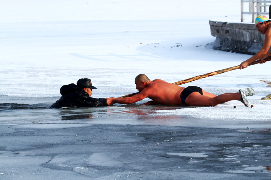 Man saved after falling through frozen lake